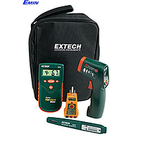 Technician handling a multifunction moisture meter during inspection and repair